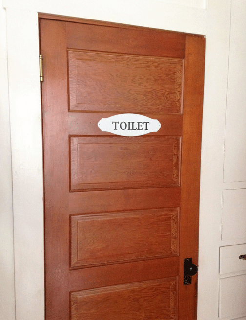 Toilet sign on door